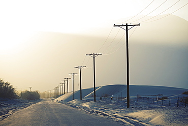 Power lines reaching into the distance, with a mountain backdrop, Hydro Lines, USA