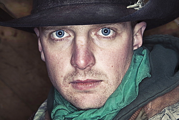 A man with bright blue eyes looking at the camera, Cowboy, Canada