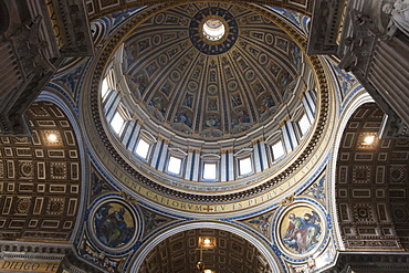 Low angle interior view of the dome of St. Peter's Basilica in Vatican City, Rome.