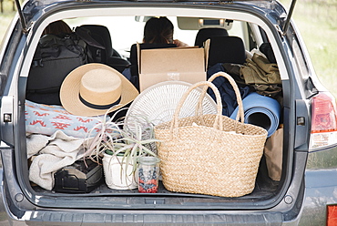 An estate car trunk full of bags and belongings, United States of America