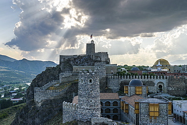 The hilltop citadel, the old fortress, castle and mosque in Akhaltsikhe at dusk under storm clouds, Akhaltsikhe, Georgia