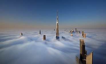 View of the Burj Khalifa and other skyscrapers above the clouds in Dubai, United Arab Emirates, Dubai, United Arab Emirates