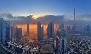 Cityscape with illuminated skyscrapers in Dubai, United Arab Emirates at dusk, Dubai, United Arab Emirates