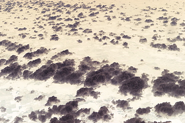 Aerial view of clouds above landscape.