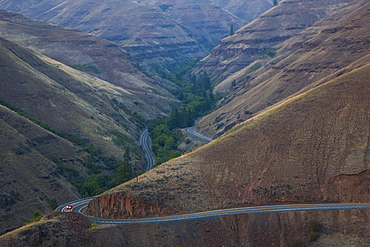 A view from above of a car on the highway in the Grande Ronde scenic area of eastern Washington State, United States of America