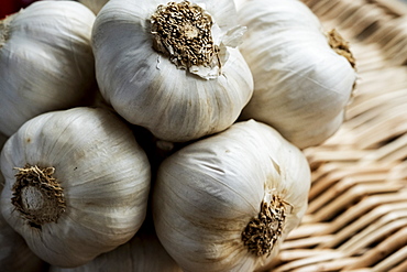 High angle view of a few garlic bulbs in a basket