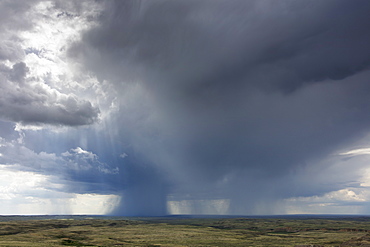 Dark storm clouds of over Grasslands National Park, Saskatchewan, Canada