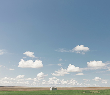 Small barn on vast open prairie, Saskatchewan, Canada