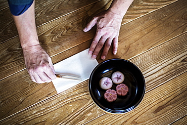 High angle close up of a bowl with Wagashi, a sweet traditionally served during a Japanese Tea Ceremony, Kyushu, Japan