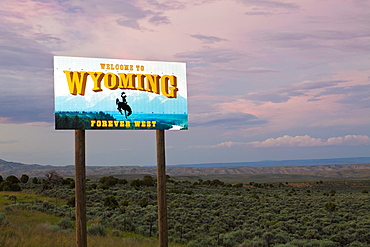 Cowboy on bucking bronco on Welcome to Wyoming sign, Wyoming, United States, Wyoming, United States of America