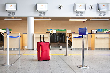 Suitcase at airport check-in counter, Estonia