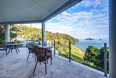 Table and chairs on balcony overlooking Bay of Islands, Paihia, New Zealand, Bay of Islands, Paihia, New Zealand