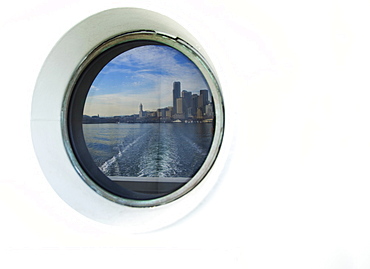 City skyline reflected in ferry porthole, Seattle, Washington, United States, Seattle, Washington, USA