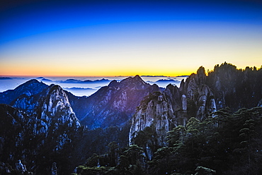 Clouds rolling over rocky mountains, Huangshan, Anhui, China, Huangshan, Anhui, China