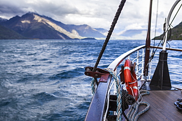 Boat on lake near mountain, Queenstown, New Zealand