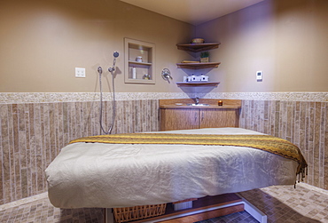 Massage table in beauty salon