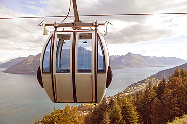 Ski lift overlooking mountain and lake