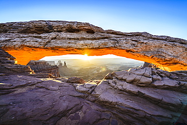 Sun rising over mesa arch, Canyonlands, Utah, United States