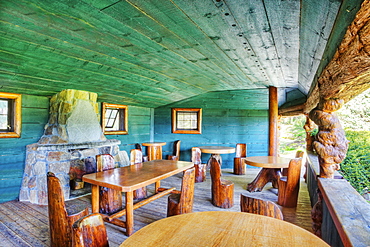 Rustic chairs and tables on restaurant patio