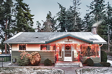 Snowy house with Christmas lights