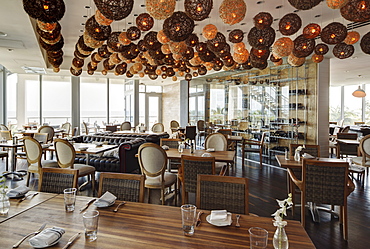 Lanterns over tables in modern restaurant, Miami, Florida, USA