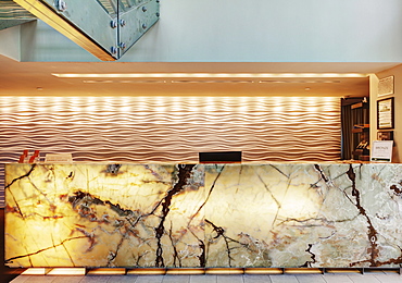 Marble reception desk in hotel lobby, Miami, Florida, USA