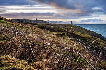 Cardigan Bay with distant stone cairn marking the entrance to Porthgain Harbour from the Pembrokeshire Coast Trail, Pembrokeshire National Park, Wales, UK, Pembrokeshire National Park, Wales