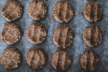 High angle close up of chocolate cookie dough on a baking tray, England