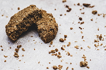 High angle close up of a freshly baked chocolate cookie broken in half, England