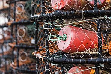 Crab and lobster pots stacked up on the quayside, close up