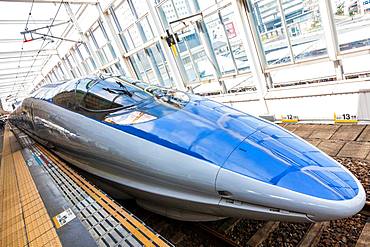 Blue Shinkansen Bullet Train at the platform of Tokyo Station, Japan