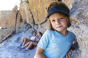 Family visiting the Tsankawi Ruins, a young boy exploring