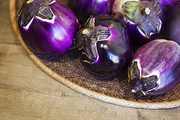 High angle close up of a selection of fresh purple aubergines in a farm shop, Kyushu, Japan