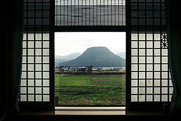 View out of the window of a luxury train, mountain landscape, Kyushu, Japan