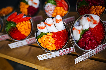 High angle close up of plastic bowls of Japanese food on display outside of a restaurant, Japan