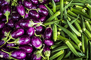 High angle close up of eggplants and okra, Singapore