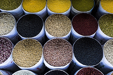 High angle close up of bags of fried beans and legumes for sale at a market, Vietnam