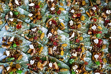 High angle close up of betel nuts wrapped in leaves on a street market, Myanmar