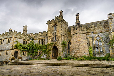 Exterior view of a Tudor fortified house, with a central entrance tower, United Kingdom