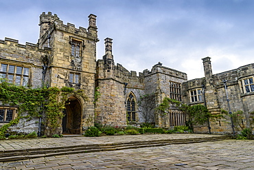 Exterior view of a Tudor fortified house, with a central entrance tower, United Kingdom