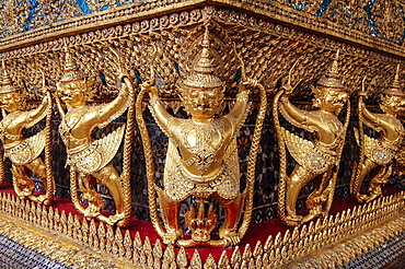 Close up of statues at the golden shrine at Wat Pho Buddhist temple complex in the Phra Nakhon District, Bangkok, Thailand