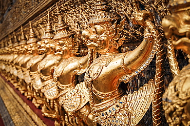 Close up of golden shrine at Wat Pho Buddhist temple complex in Bangkok, Thailand