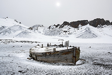 A wooden boat hull beached on Deception island, a former whaling station, Deception Island, South Shetland Islands, Antarctica