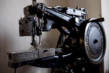 Close up of saddlery sewing machine in a saddler's workshop, Berkshire, United Kingdom