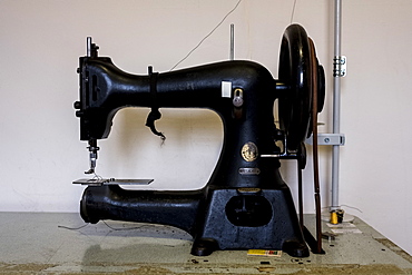 Close up of saddlery sewing machine in a saddler's workshop, Berkshire, United Kingdom