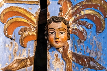 Carved head on wooden door, Tavira, Algarve, Portugal