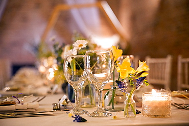 Close up of festive place setting for a naming ceremony in an historic barn