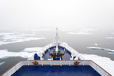 The view over the decks of a cruise ship in the Canadian Arctic region, moving through ice floes, Canada