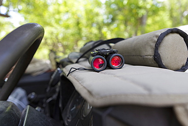 Binoculars on the dashboard of a safari jeep, Botswana