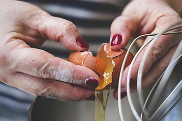 Cook separating eggs for baking